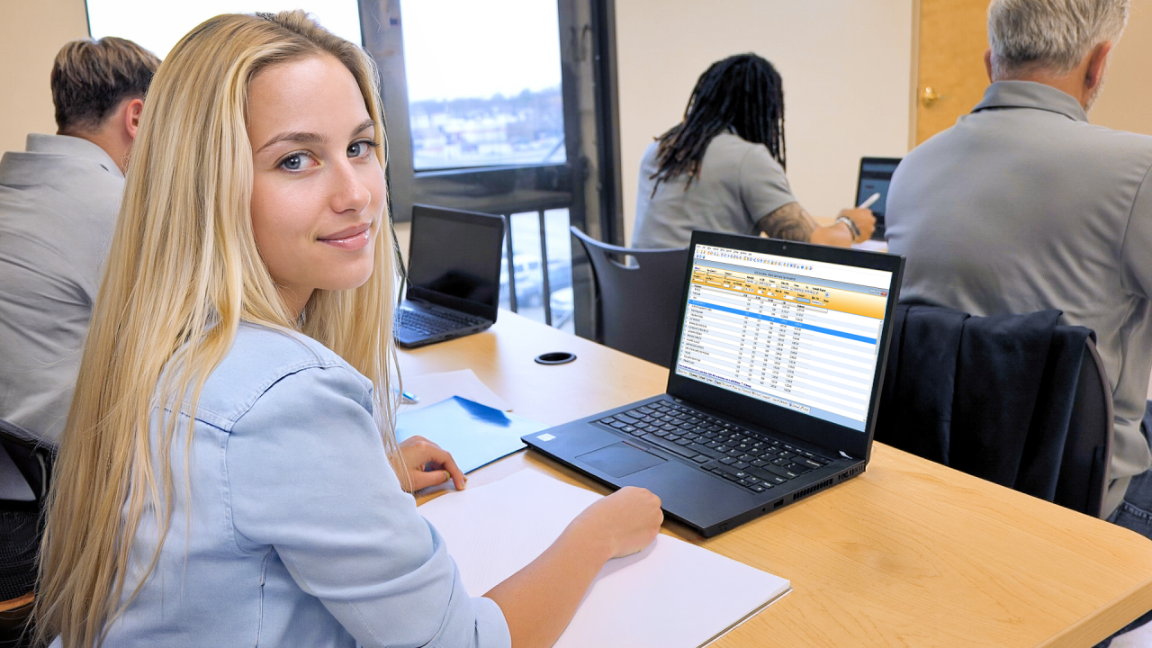 students in classroom on laptops